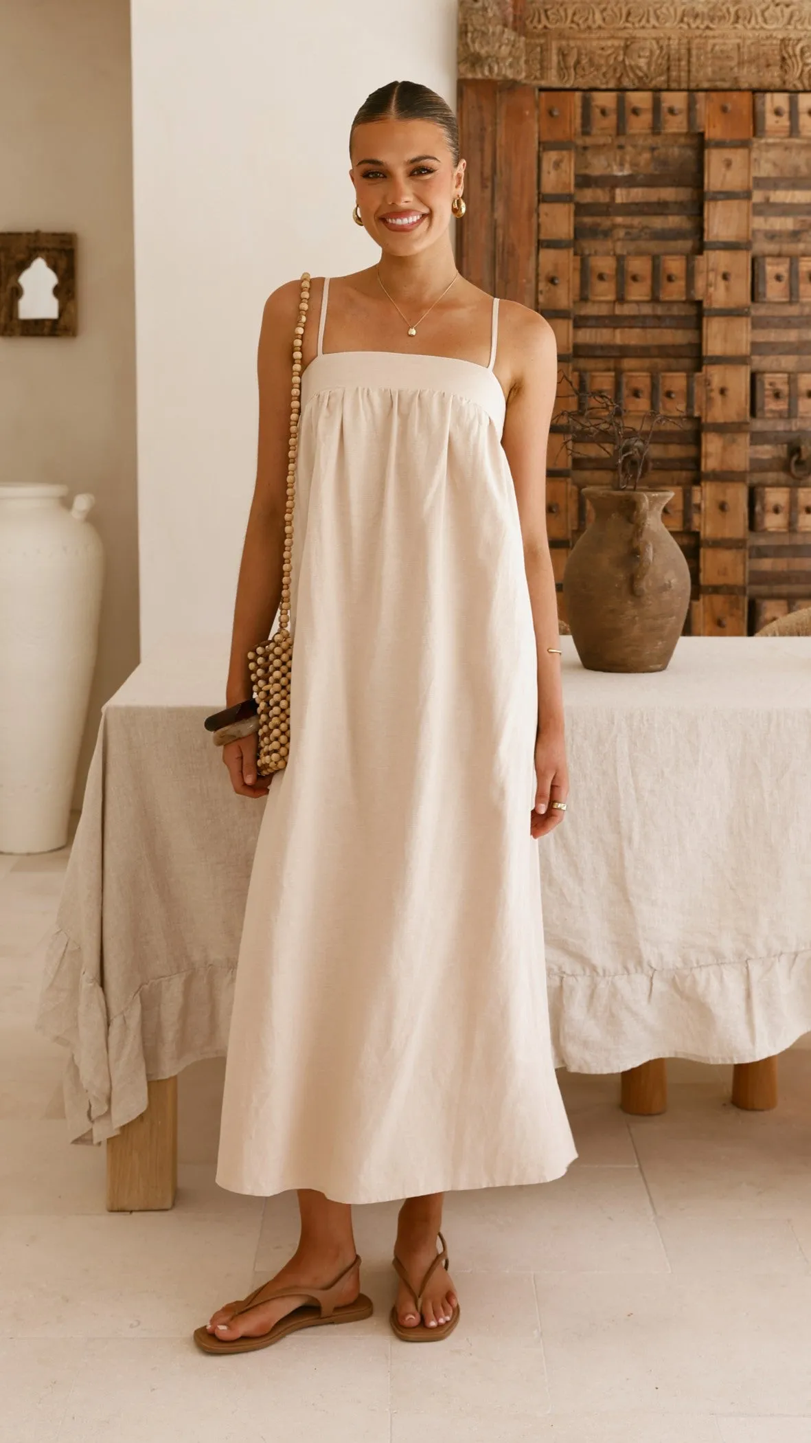 This maxi dress combines a relaxed fit with an elegant look for a versatile wardrobe piece Layer Glow Gracia Maxi Dress - Beige