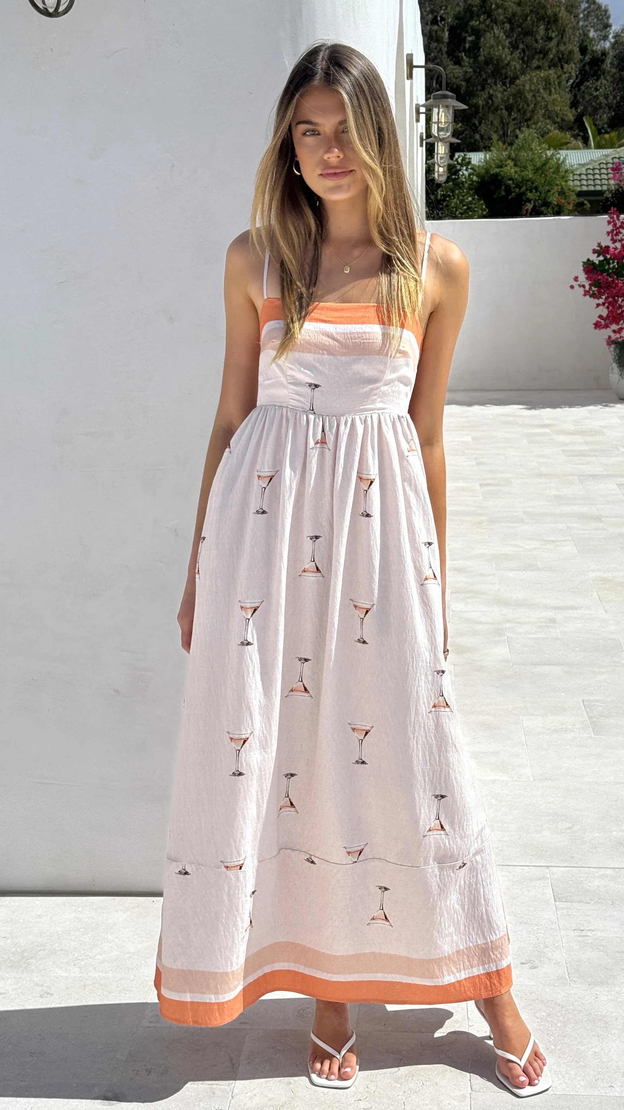 The sleek lines of this maxi dress create a flattering and elegant look for any event Park Date Penny Maxi Dress - Peach Martini