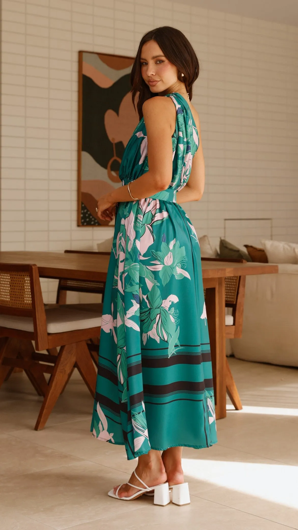 This dress is a versatile option that can be styled in many different ways Breezy formal outfit Hadas Maxi Dress - Green Print