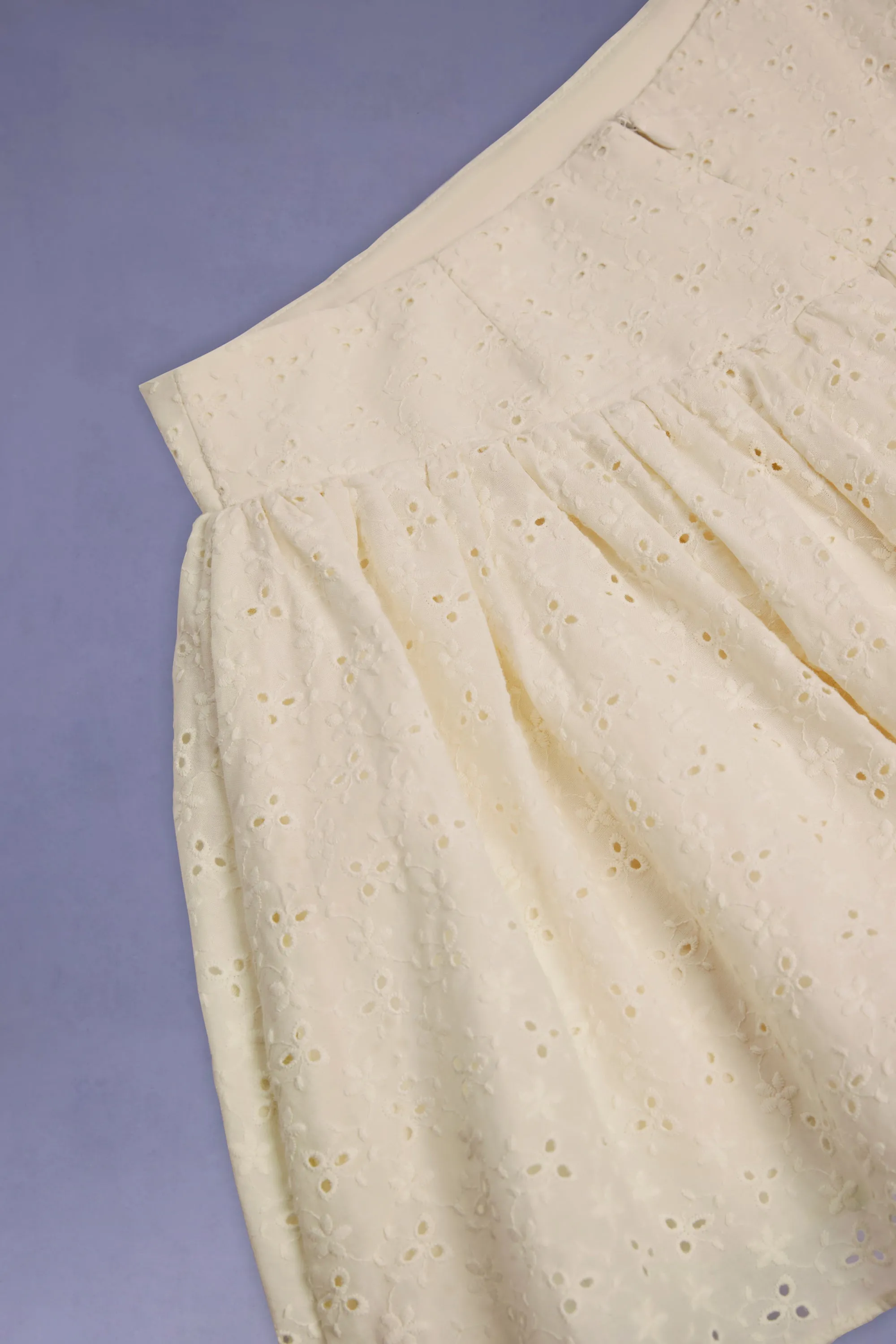 Neat Finish Bow-Detail Broderie Anglaise Mini Skirt in Ivory