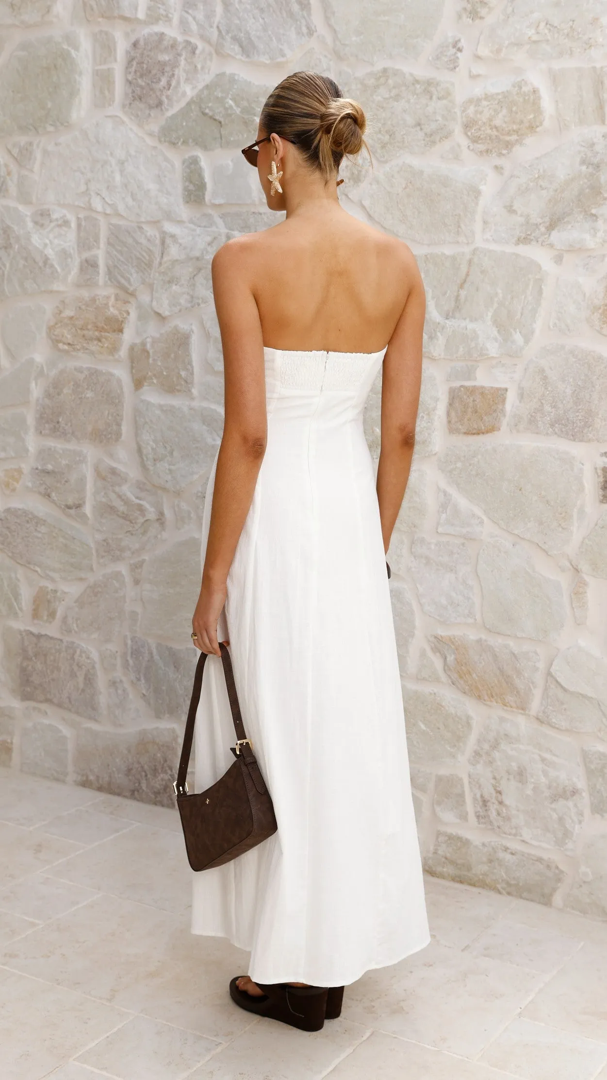 The classic design of this maxi dress makes it an essential piece for any fashion-forward wardrobe Sophisticated summer attire Astrid Strapless Maxi Dress - White