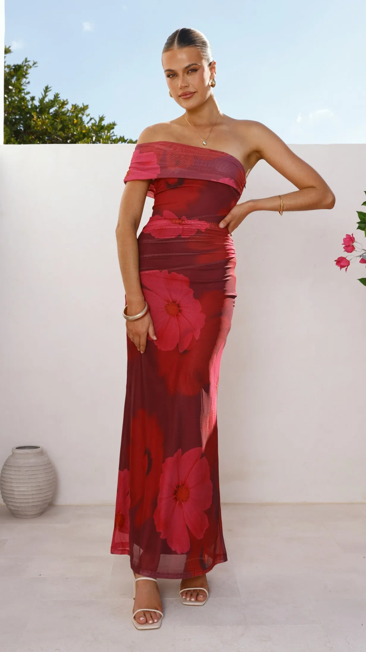 This maxi dress is perfect for creating a chic and polished look without trying too hard Jelani Maxi Dress - Red Floral