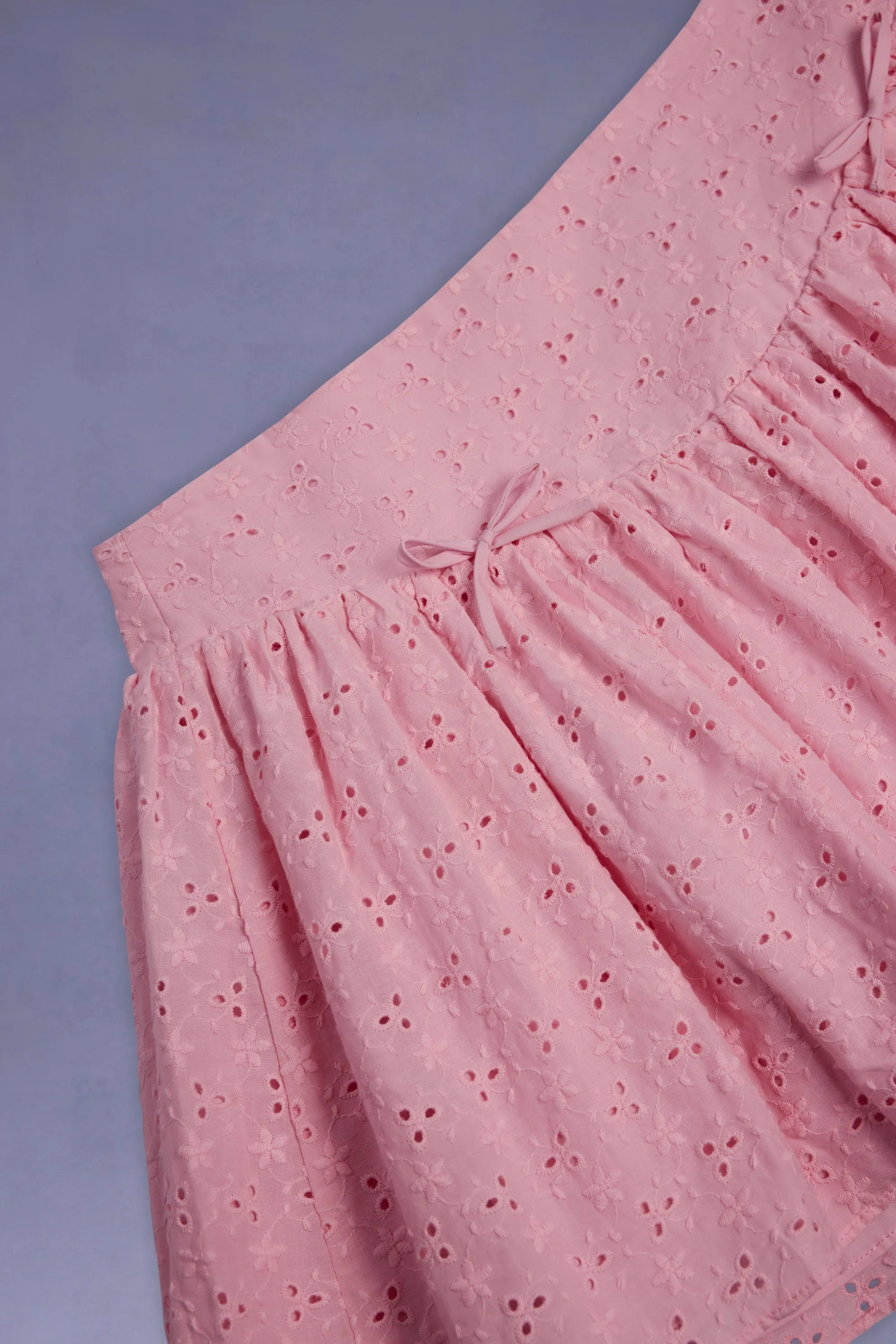 Bow-Detail Broderie Anglaise Mini Skirt in Soft Pink Breezy Edge